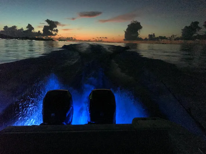 Endless Summer Yacht Photos Pics Boston Whaler 320 Outrage 2014 at sunset on the water.