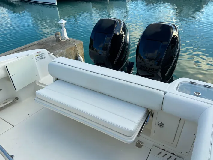 Endless Summer Yacht Photos Pics 2014 Boston Whaler 320 Outrage with twin engines at the dock.