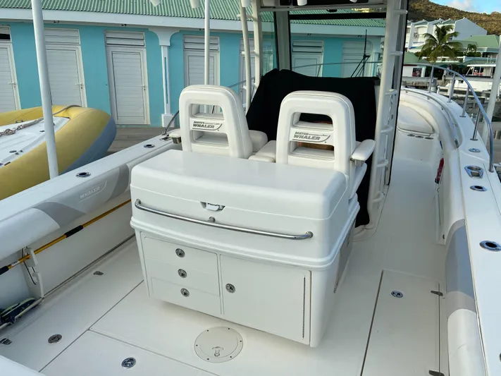 Endless Summer Yacht Photos Pics 2014 Boston Whaler 320 Outrage with seating and storage area.