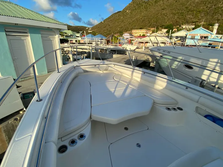 Endless Summer Yacht Photos Pics 2014 Boston Whaler 320 Outrage docked, sunny day, mountain backdrop.