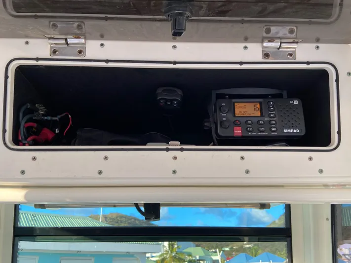 Endless Summer Yacht Photos Pics Boston Whaler 320 Outrage 2014 with Simrad radio in storage compartment.