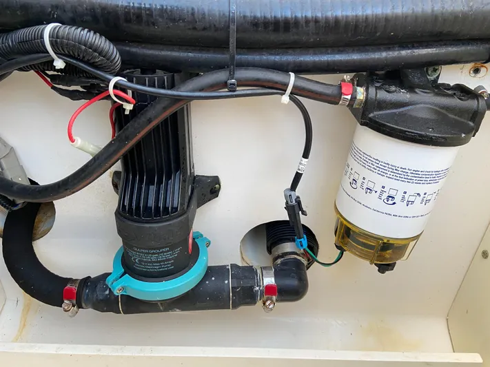 Endless Summer Yacht Photos Pics Engine compartment of 2014 Boston Whaler 320 Outrage with filter and hoses.