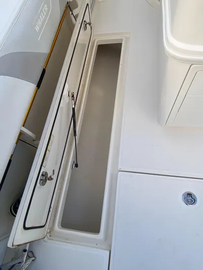 Endless Summer Yacht Photos Pics Storage compartment on a 2014 Boston Whaler 320 Outrage boat.