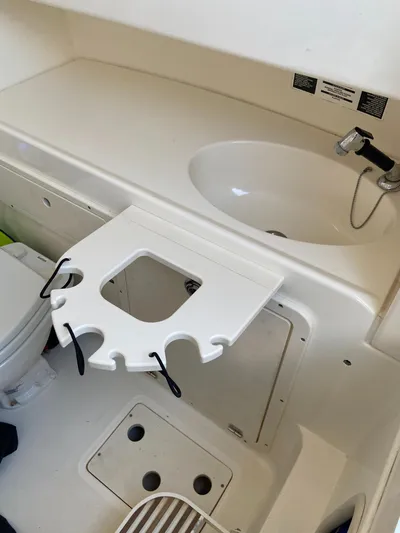 Endless Summer Yacht Photos Pics Interior of a 2014 Boston Whaler 320 Outrage boat with sink.