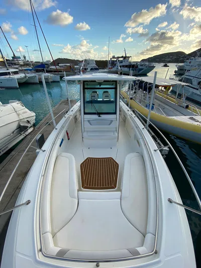 Endless Summer Yacht Photos Pics Boston Whaler 320 Outrage 2014 at dock, sunny sky, calm waters.
