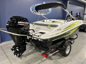 2024 Tahoe T16 boat with Mercury outboard motor at dealership.