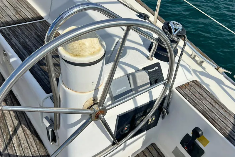  Yacht Photos Pics Steering wheel of 2008 Jeanneau Sun Odyssey 42i Performance sailboat with Raymarine equipment.