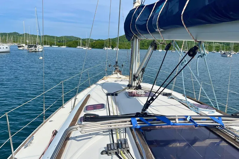  Yacht Photos Pics 2008 Jeanneau Sun Odyssey 42i Performance sailboat on calm water, surrounded by other boats.