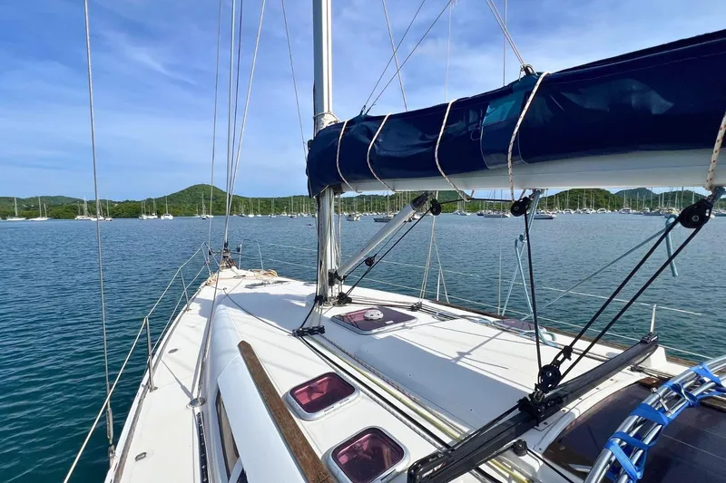  Yacht Photos Pics Sailboat Jeanneau Sun Odyssey 42i Performance, 2008, on calm water with scenic background.