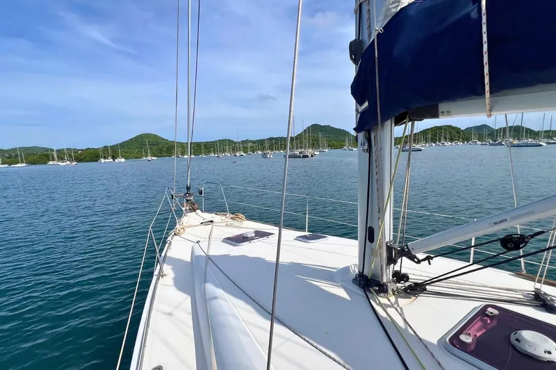  Yacht Photos Pics Sailboat Jeanneau Sun Odyssey 42i Performance, 2008, on calm waters with scenic hills.