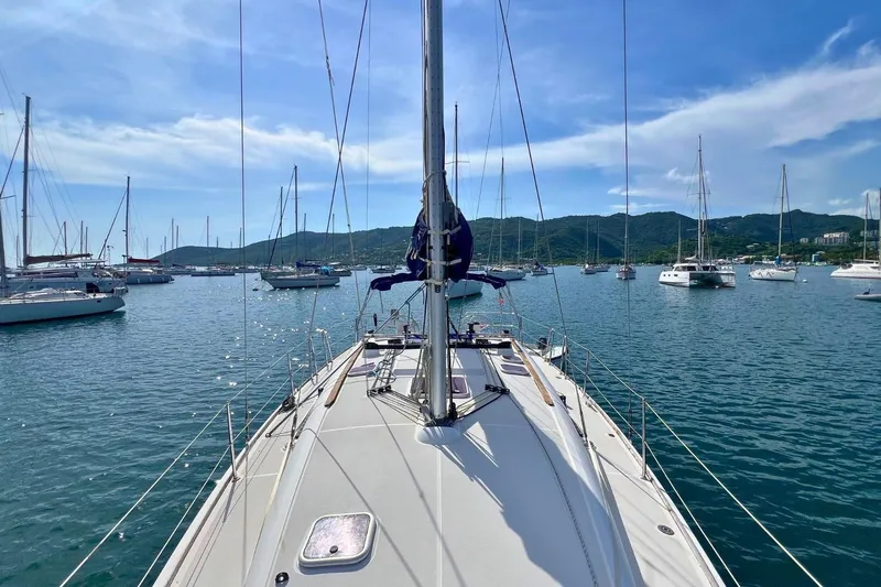  Yacht Photos Pics Sailing on Jeanneau Sun Odyssey 42i Performance, 2008, in a scenic marina with hills.