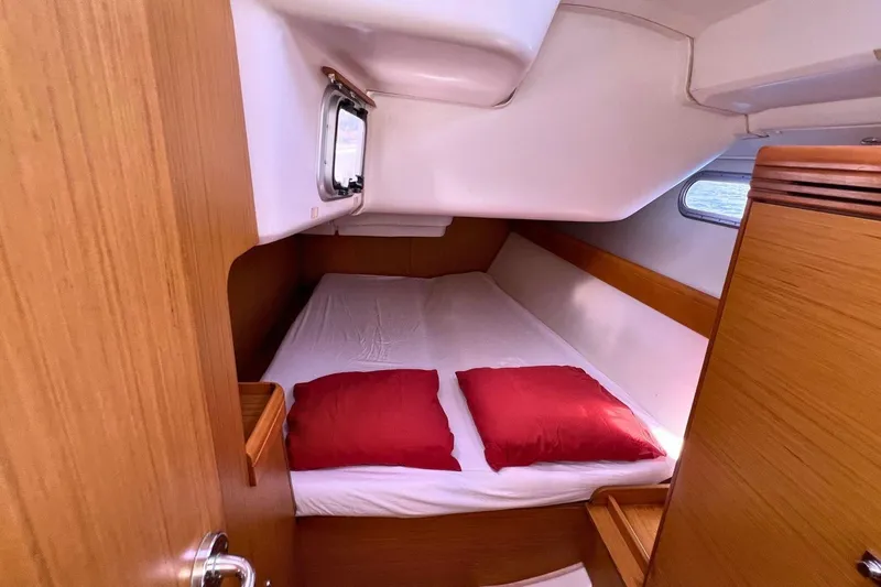  Yacht Photos Pics Cozy cabin interior of 2008 Jeanneau Sun Odyssey 42i Performance sailboat.