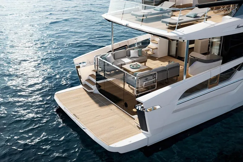  Yacht Photos Pics Luxurious 2026 Absolute Navetta 66 yacht with elegant deck and modern seating on the ocean.
