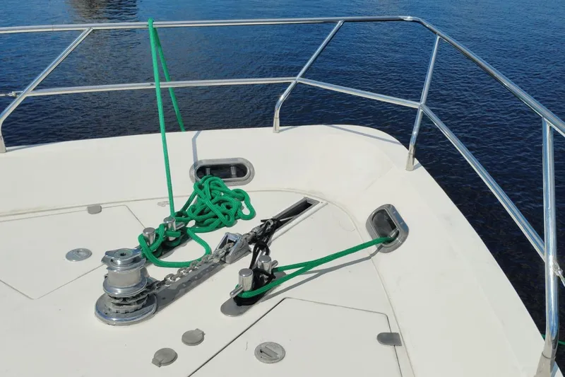  Yacht Photos Pics Bow of 2001 Viking Princess 72 yacht with anchor and green rope.