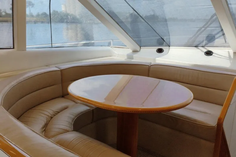  Yacht Photos Pics Luxurious seating area on a 2001 Viking Princess 72 yacht with panoramic windows.