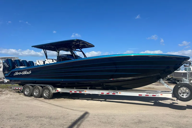  Yacht Photos Pics 2026 Nor-Tech 390 Sport Center Console boat on trailer under clear blue sky.
