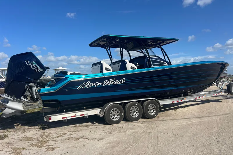  Yacht Photos Pics 2026 Nor-Tech 390 Sport Center Console boat on trailer, blue and black design.