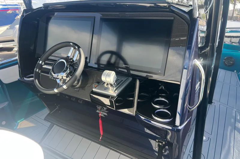  Yacht Photos Pics 2026 Nor-Tech 390 Sport Center Console helm with dual screens and modern controls.