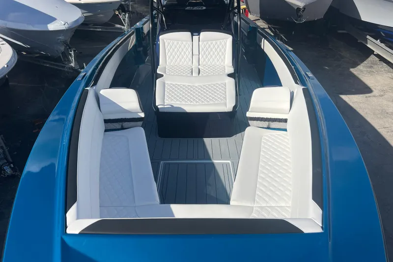  Yacht Photos Pics 2026 Nor-Tech 390 Sport Center Console with white seating and sleek blue exterior.