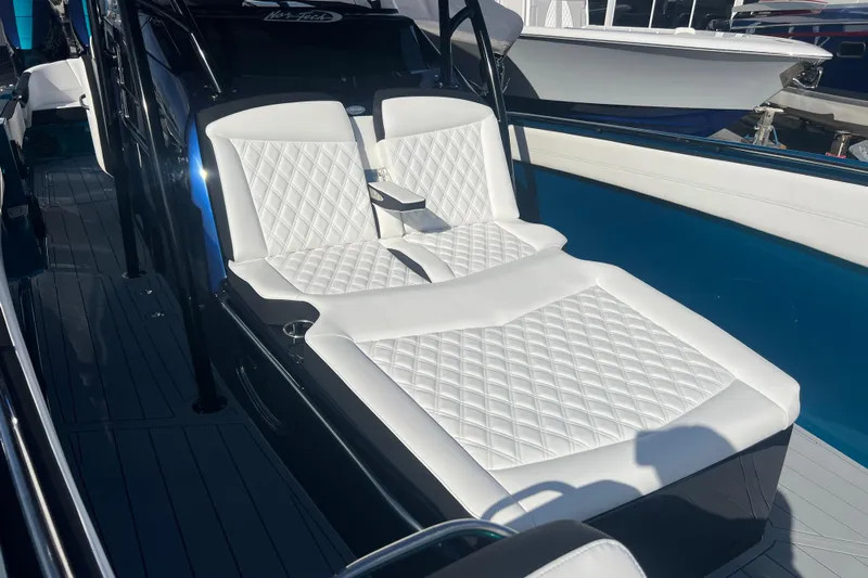  Yacht Photos Pics 2026 Nor-Tech 390 Sport Center Console with luxurious white seating.