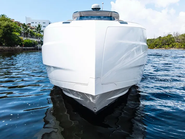 Sea-curitini Yacht Photos Pics 2024 Astondoa 377 yacht on water, front view, sleek design, clear sky background.