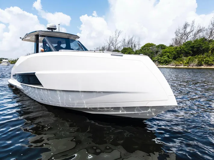 Sea-curitini Yacht Photos Pics 2024 Astondoa 377 yacht cruising on a sunny day, sleek design, calm waters.