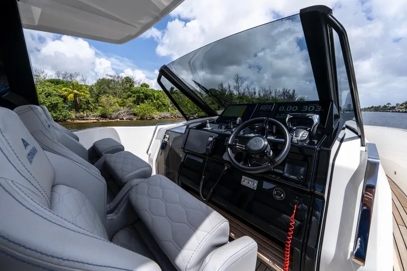 Sea-curitini Yacht Photos Pics 2024 Astondoa 377 yacht cockpit with modern controls and luxurious seating.