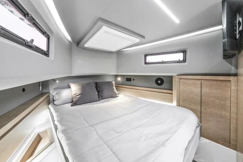 Sea-curitini Yacht Photos Pics Luxurious cabin interior of 2024 Astondoa 377 yacht with modern bedding and sleek design.