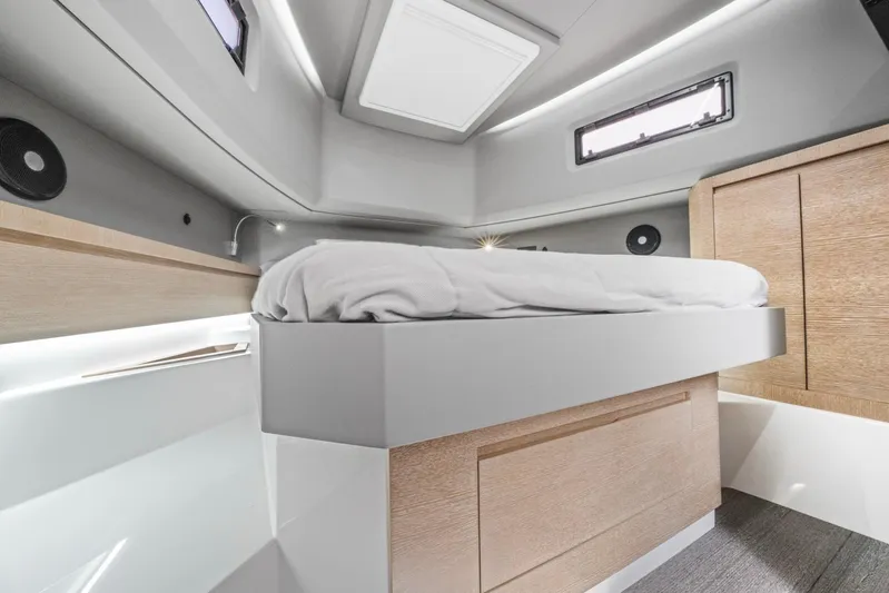 Sea-curitini Yacht Photos Pics Luxurious cabin interior of 2024 Astondoa 377 yacht, featuring modern design and comfortable bedding.