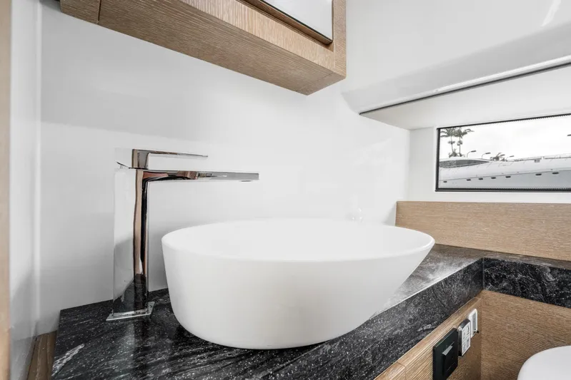 Sea-curitini Yacht Photos Pics Luxurious bathroom sink in 2024 Astondoa 377 yacht, featuring modern design and elegant fixtures.