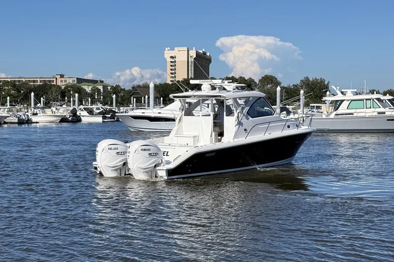 Seaquel Yacht Photos Pics 2026 Pursuit OS 355 Offshore boat with twin Yamaha engines in a marina setting.