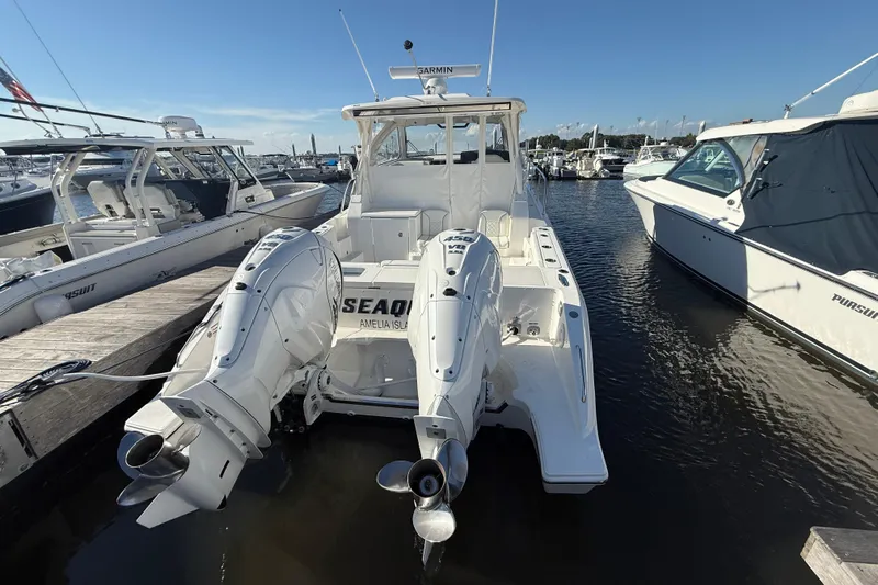 Seaquel Yacht Photos Pics 2026 Pursuit OS 355 Offshore boat docked with twin outboard engines.