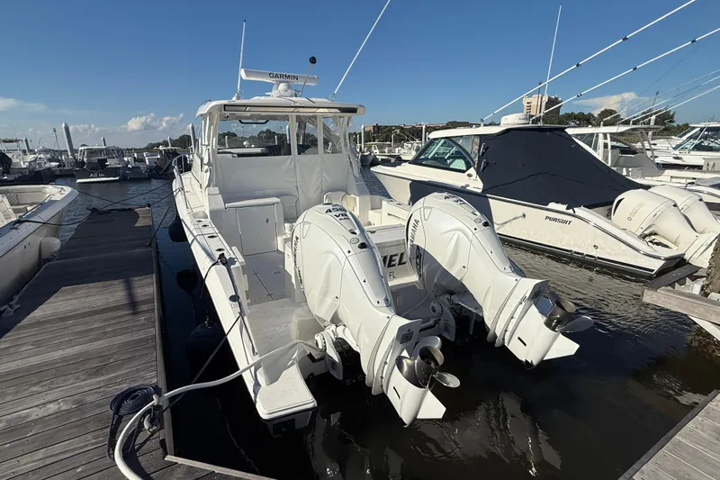 Seaquel Yacht Photos Pics 2026 Pursuit OS 355 Offshore boat docked with twin Yamaha outboard engines.