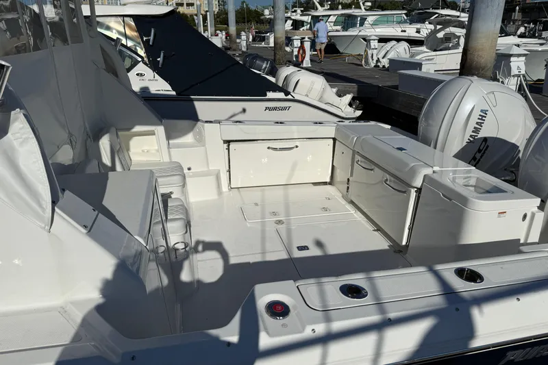 Seaquel Yacht Photos Pics 2026 Pursuit OS 355 Offshore boat interior with Yamaha engines at a marina.