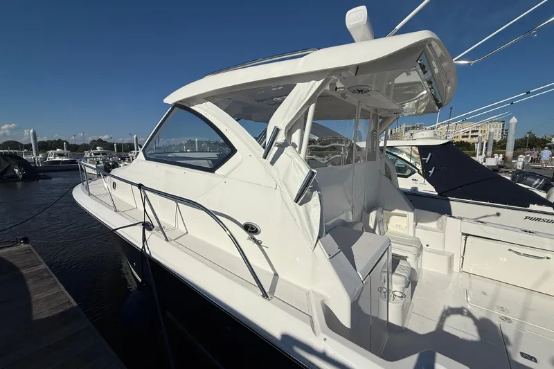 Seaquel Yacht Photos Pics 2026 Pursuit OS 355 Offshore boat docked, showcasing sleek design and spacious deck.