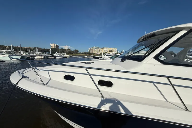 Seaquel Yacht Photos Pics 2026 Pursuit OS 355 Offshore boat docked at a marina under clear blue skies.