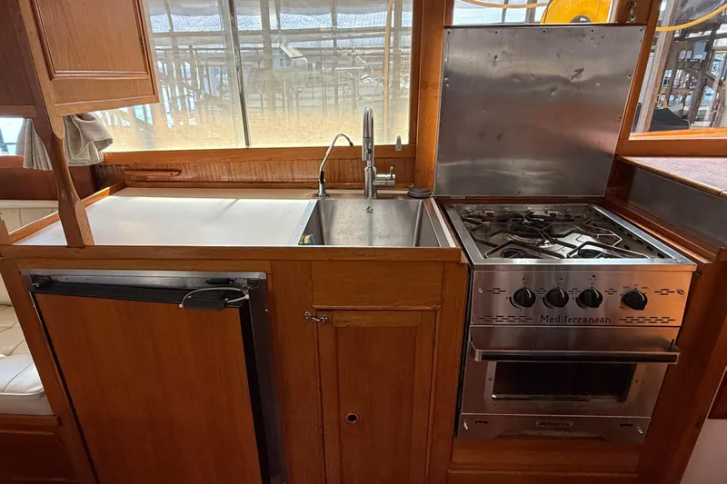 Badger Yacht Photos Pics Galley kitchen in 1980 Grand Banks 36 Classic yacht with stove and sink.