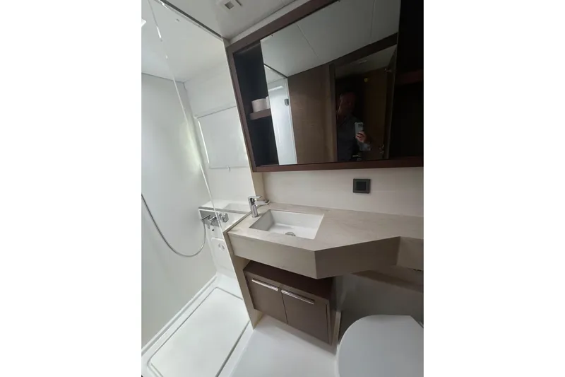 Cc Princess Yacht Photos Pics Modern bathroom in 2020 Lagoon 46 yacht with shower, sink, and storage.