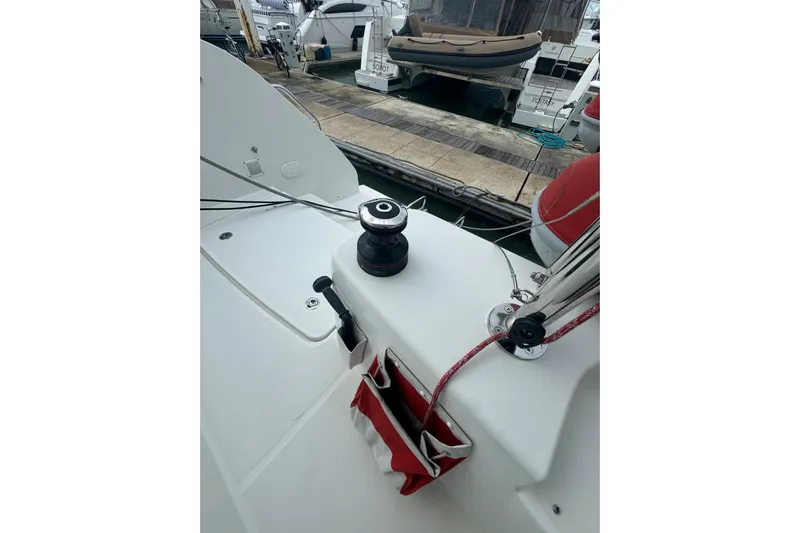 Cc Princess Yacht Photos Pics 2020 Lagoon 46 yacht deck with winch and red rope, docked at marina.