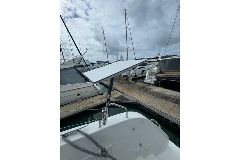 Cc Princess Yacht Photos Pics 2020 Lagoon 46 catamaran docked at marina under cloudy sky.