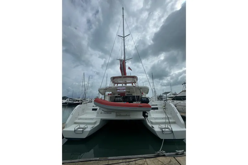 Cc Princess Yacht Photos Pics 2020 Lagoon 46 catamaran docked at marina under cloudy sky.