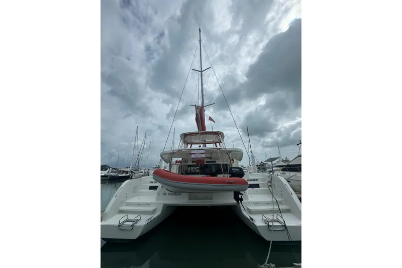 Cc Princess Yacht Photos Pics 2020 Lagoon 46 catamaran docked at marina under cloudy sky.