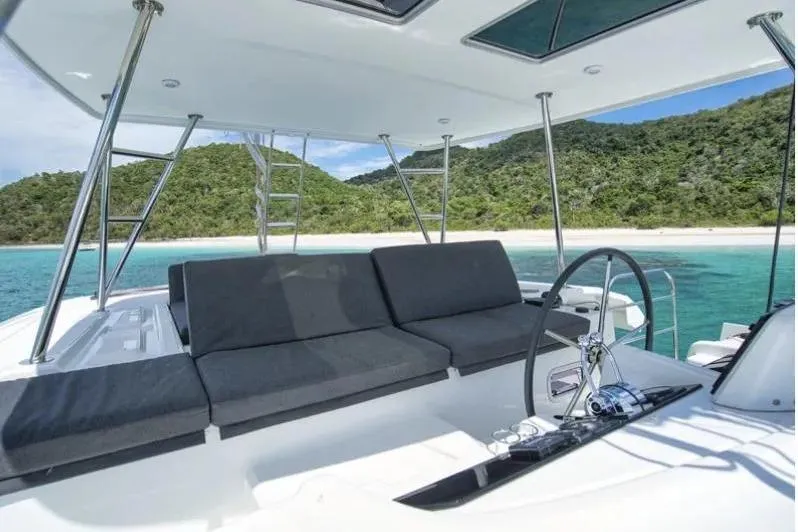 Cc Princess Yacht Photos Pics 2020 Lagoon 46 catamaran with spacious deck, anchored near a tropical island.