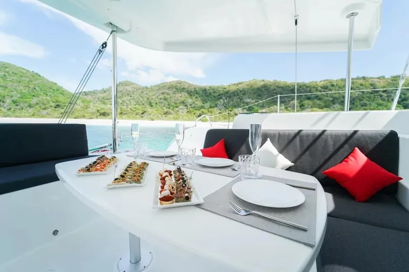 Cc Princess Yacht Photos Pics Luxurious dining setup on a 2020 Lagoon 46 yacht with scenic ocean view.