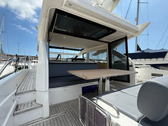 Boo Boo Yacht Photos Pics Sunseeker Predator 50 yacht, 2020 model, featuring a sleek deck and modern seating area.
