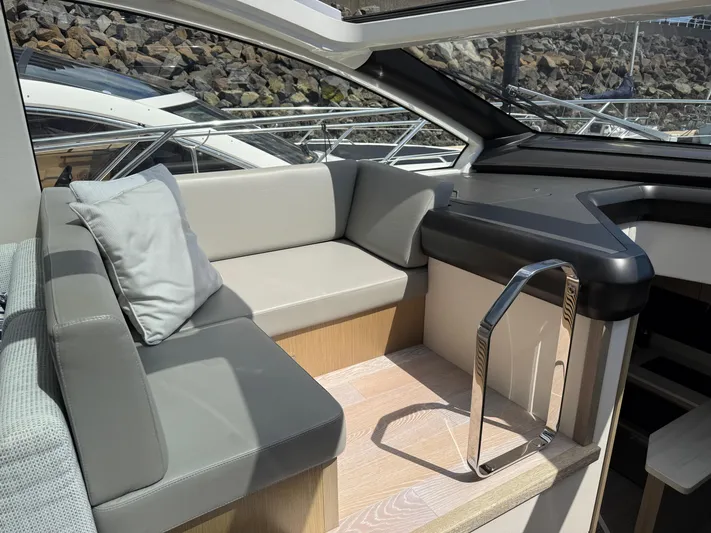 Boo Boo Yacht Photos Pics Luxurious interior of 2020 Sunseeker Predator 50 yacht with sleek seating and modern design.