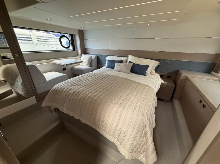 Boo Boo Yacht Photos Pics Luxurious bedroom interior of 2020 Sunseeker Predator 50 yacht with elegant furnishings.