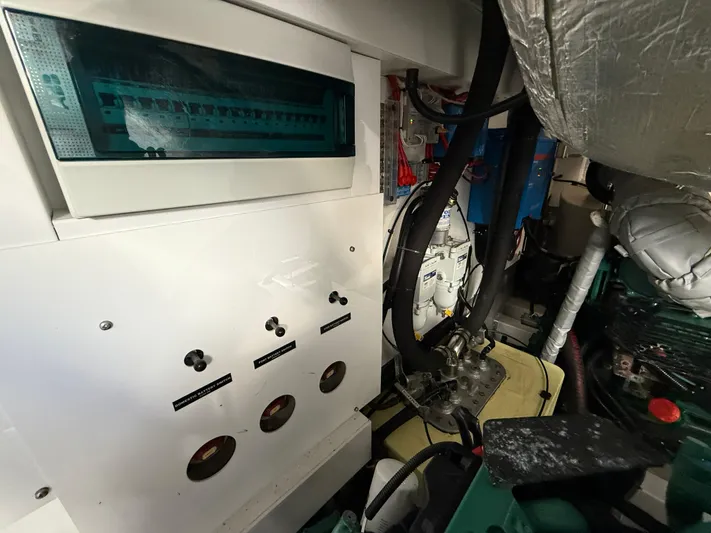 Boo Boo Yacht Photos Pics Engine room of 2020 Sunseeker Predator 50 yacht, showcasing control panels and machinery.