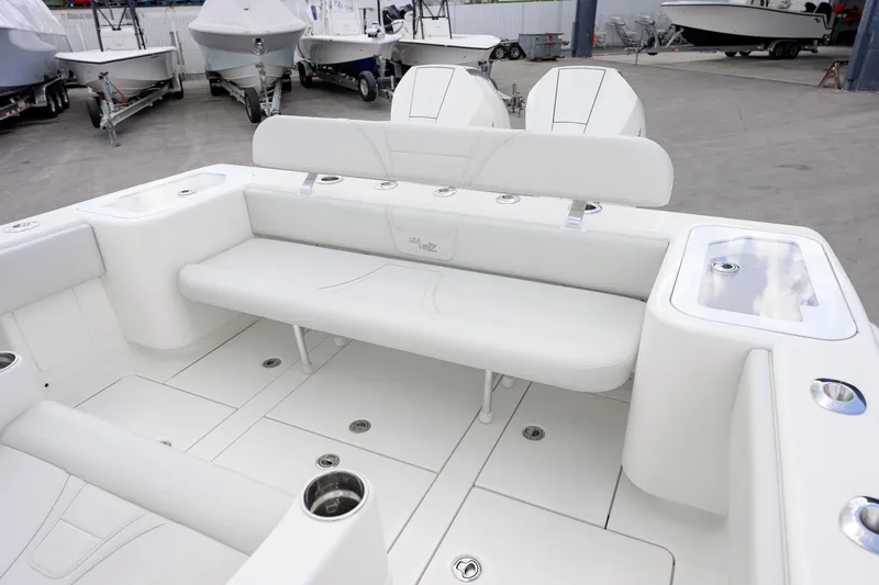 Seavee Yacht Photos Pics 2021 SeaVee 322Z boat interior with white seating and storage compartments.