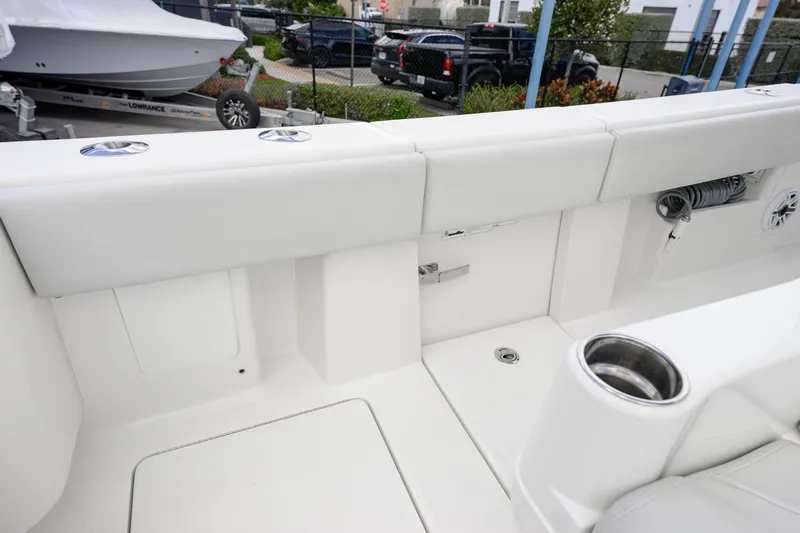 Seavee Yacht Photos Pics 2021 SeaVee 322Z boat interior with white seating and cup holder.
